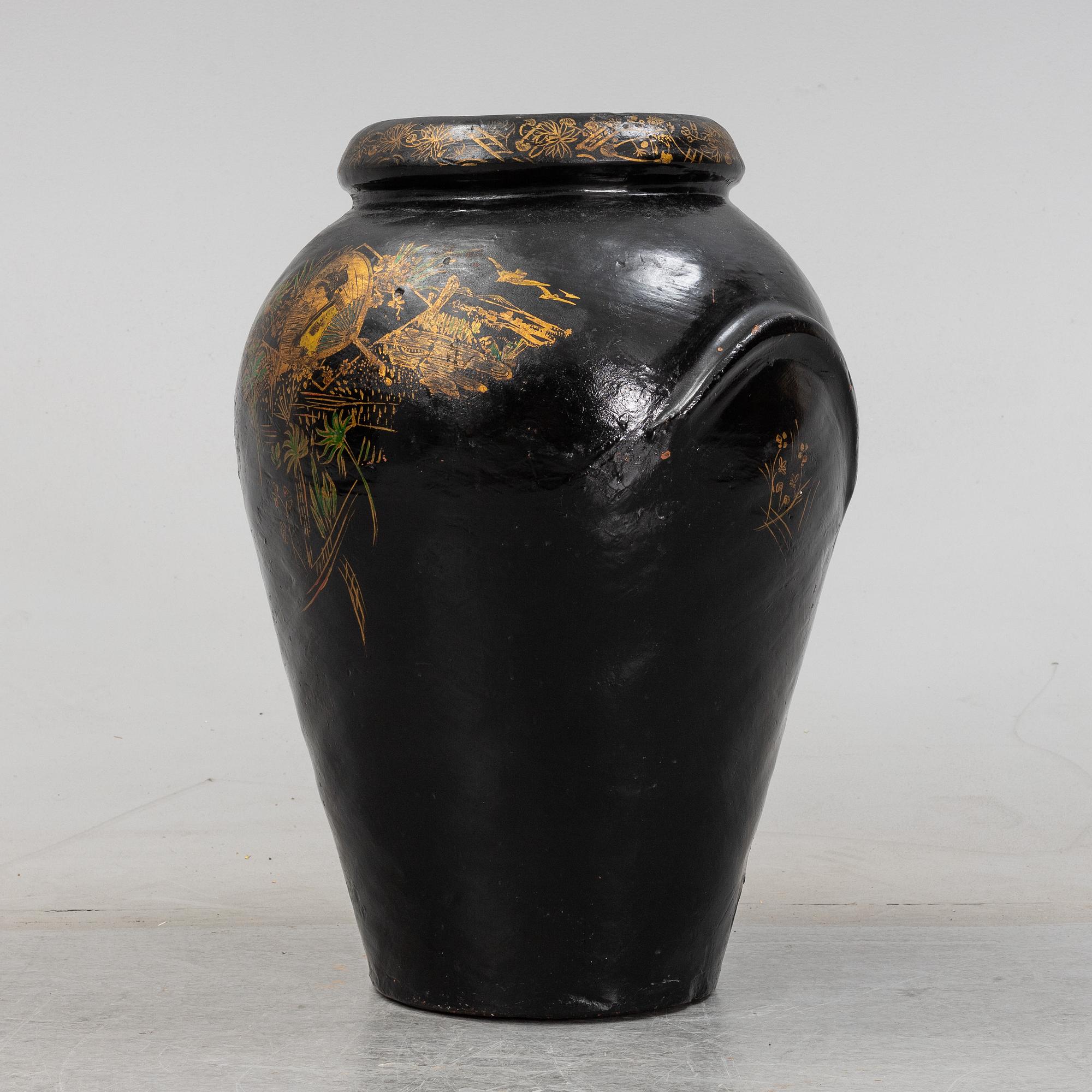 A 20th Century earhten ware urn.