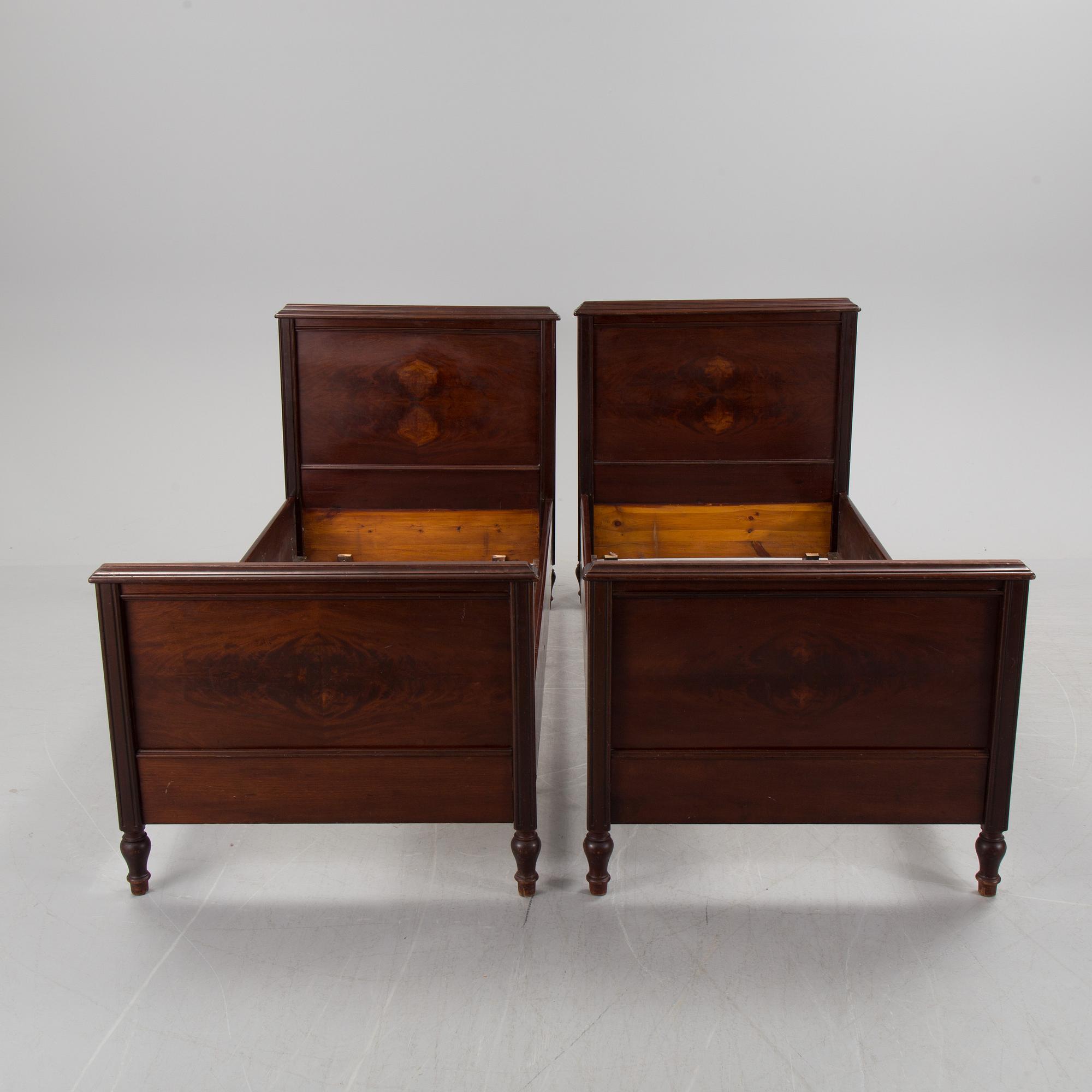A pair of  mahognay veneered headboards from around year 1900.