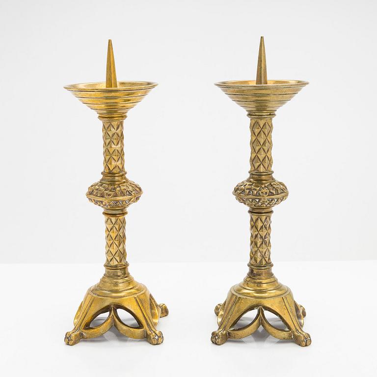A pair of 19th-century brass candlesticks.