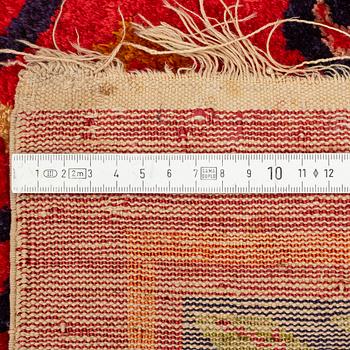 An East Turkestan silk carpet, ca 308 x 182 cm.