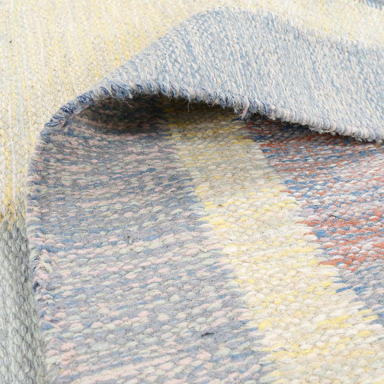 A flat weave carpet designed by Ida Rydelius from the second half of the 20th century.