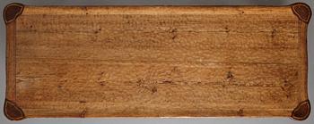 Gustaf Fjaestad, an Art Nouveau carved pine table, Arvika Sweden 1914, a double to the table in the Thiel Collection,