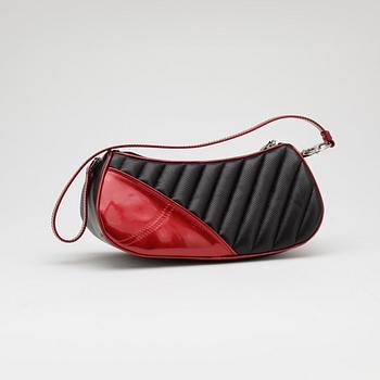 CHRISTIAN DIOR, a black leather shoulder bag with red patent details, "Montaigne Chris 1947".