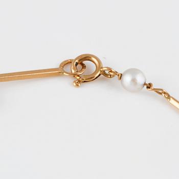 ARMBAND, 18K guld med 7 odlade pärlor, kattfotstämplat 1961. Vikt 3,7 gram.