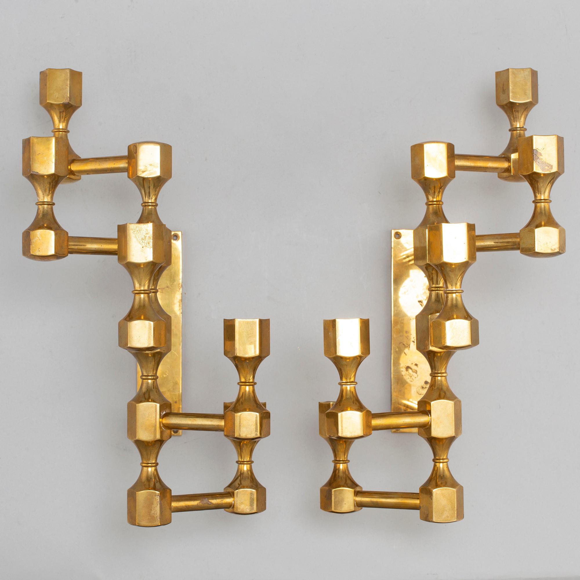 A pair of brass wall candelabras, for Gusum, signed BK and dated 1995 and 1997.
