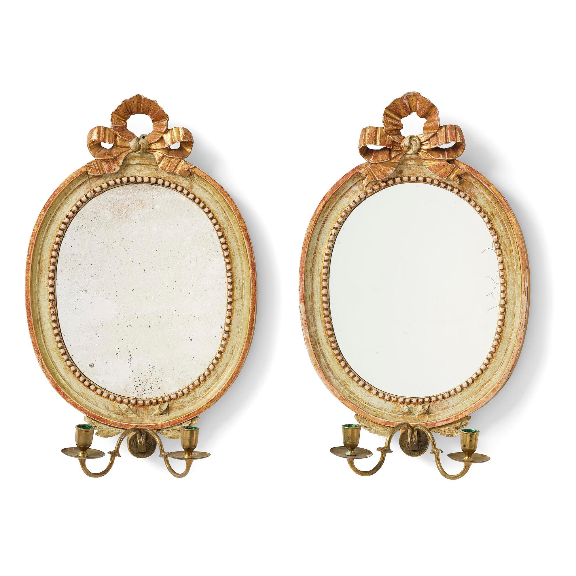 A pair of Gustaviantwo-branch giltwood girandole mirrors by C. G. Fyrwald (master in Stockholm 1776-1825).