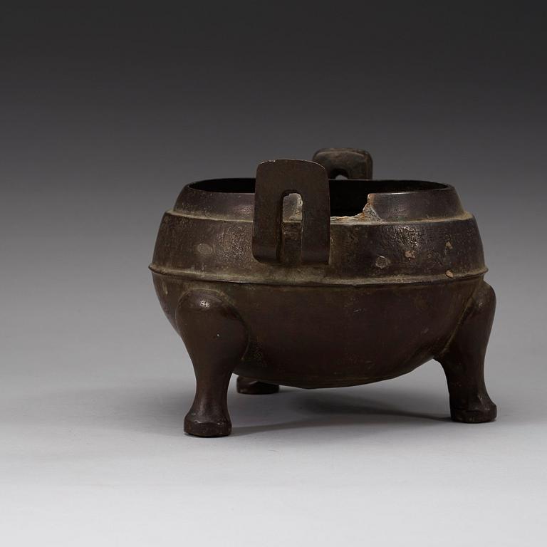 A bronze tripod censer, presumably Han dynasty (206 B.C-220 A.D).