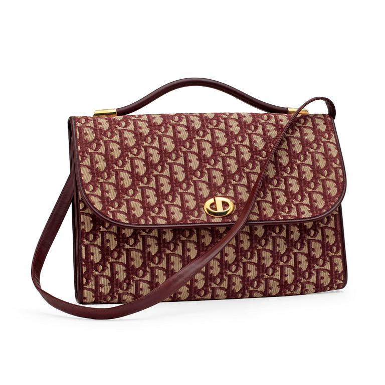 CHRISTIAN DIOR, a red monogram canvas shoulder bag.