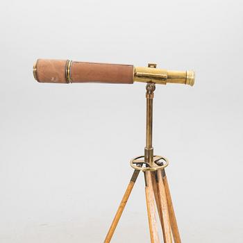 A brass and leahter tube binocular with stand around 1900.