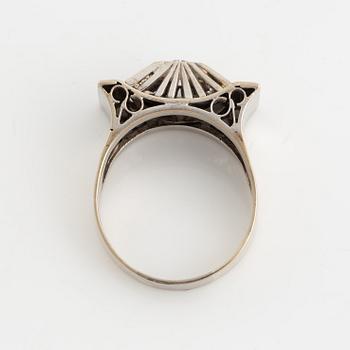 A 14K gold ring set with old-cut diamonds.