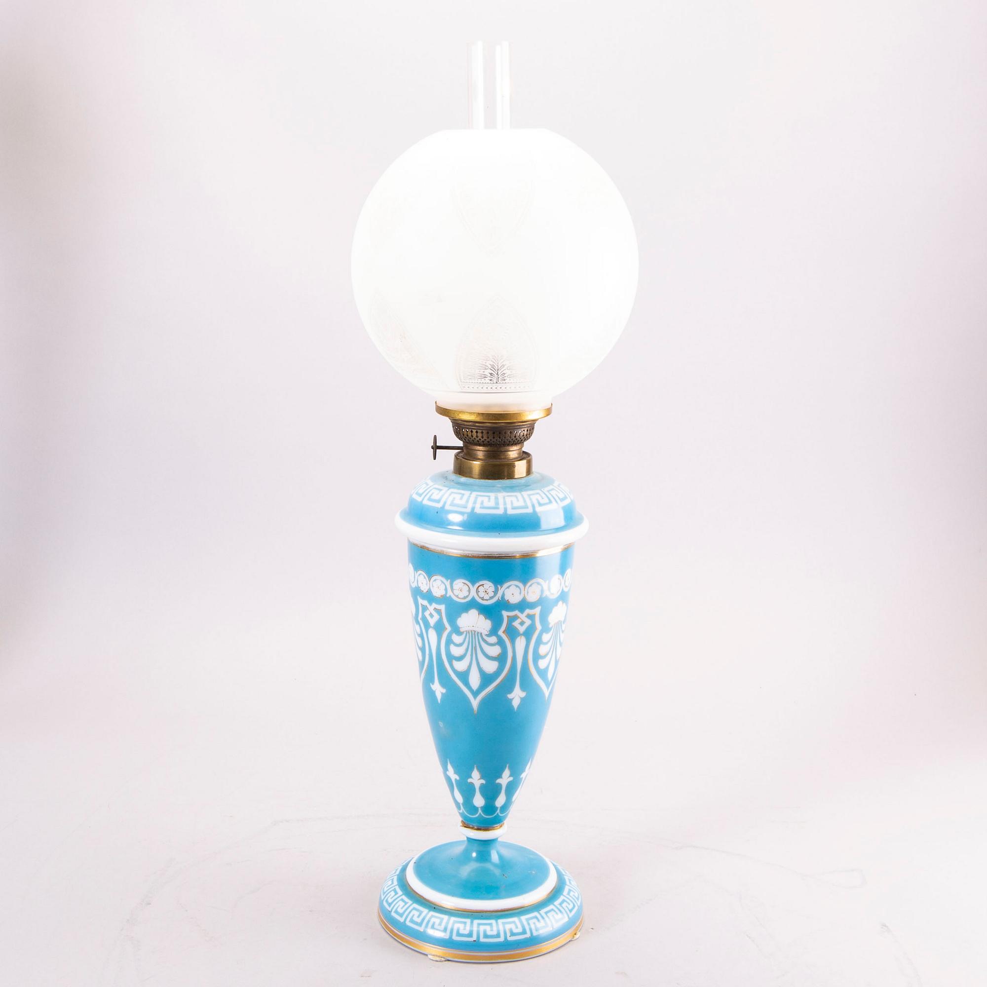A glass paraffin lamp around 1900.