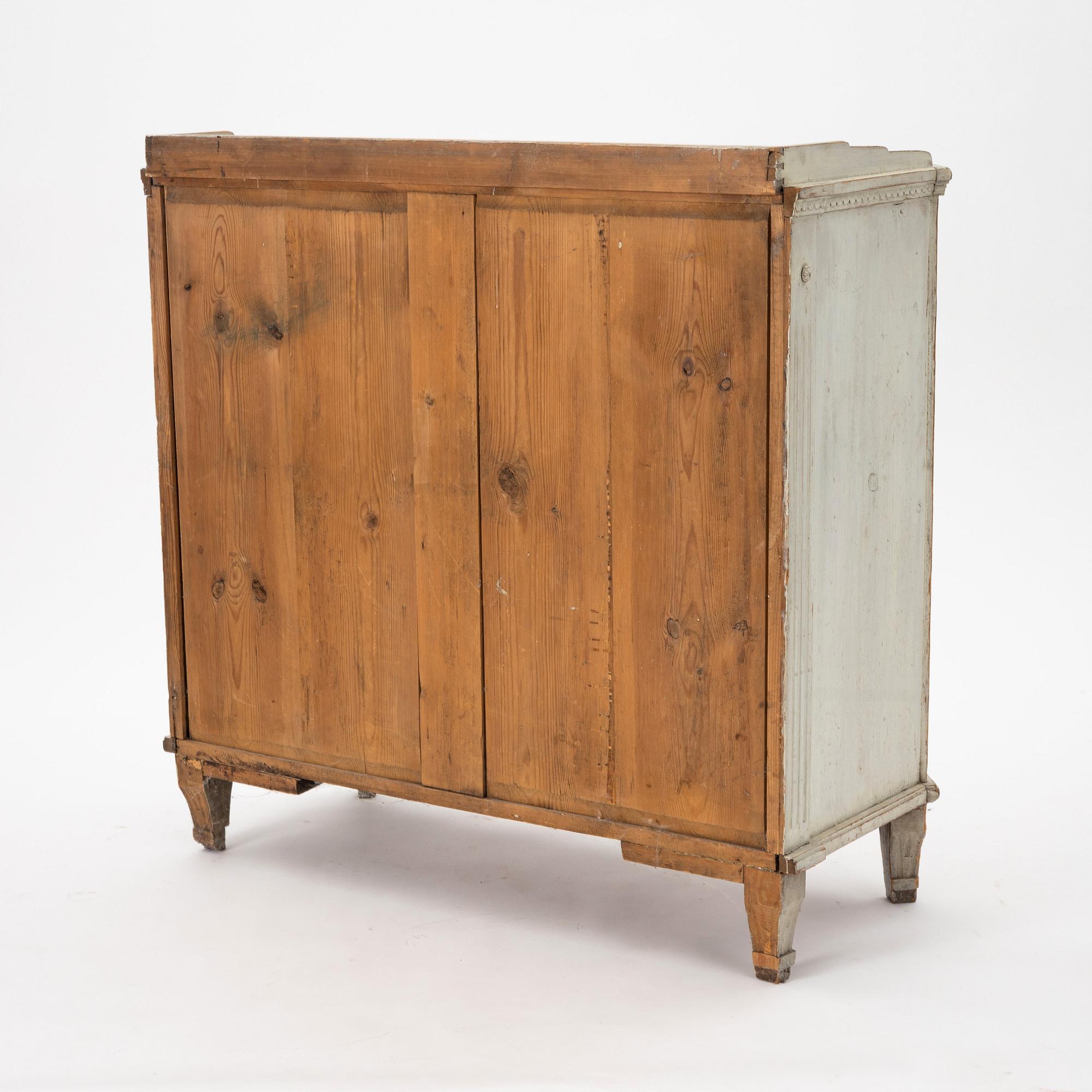 A late Gustavian grey lacquered pine cabinet, Sweden ca 1800.