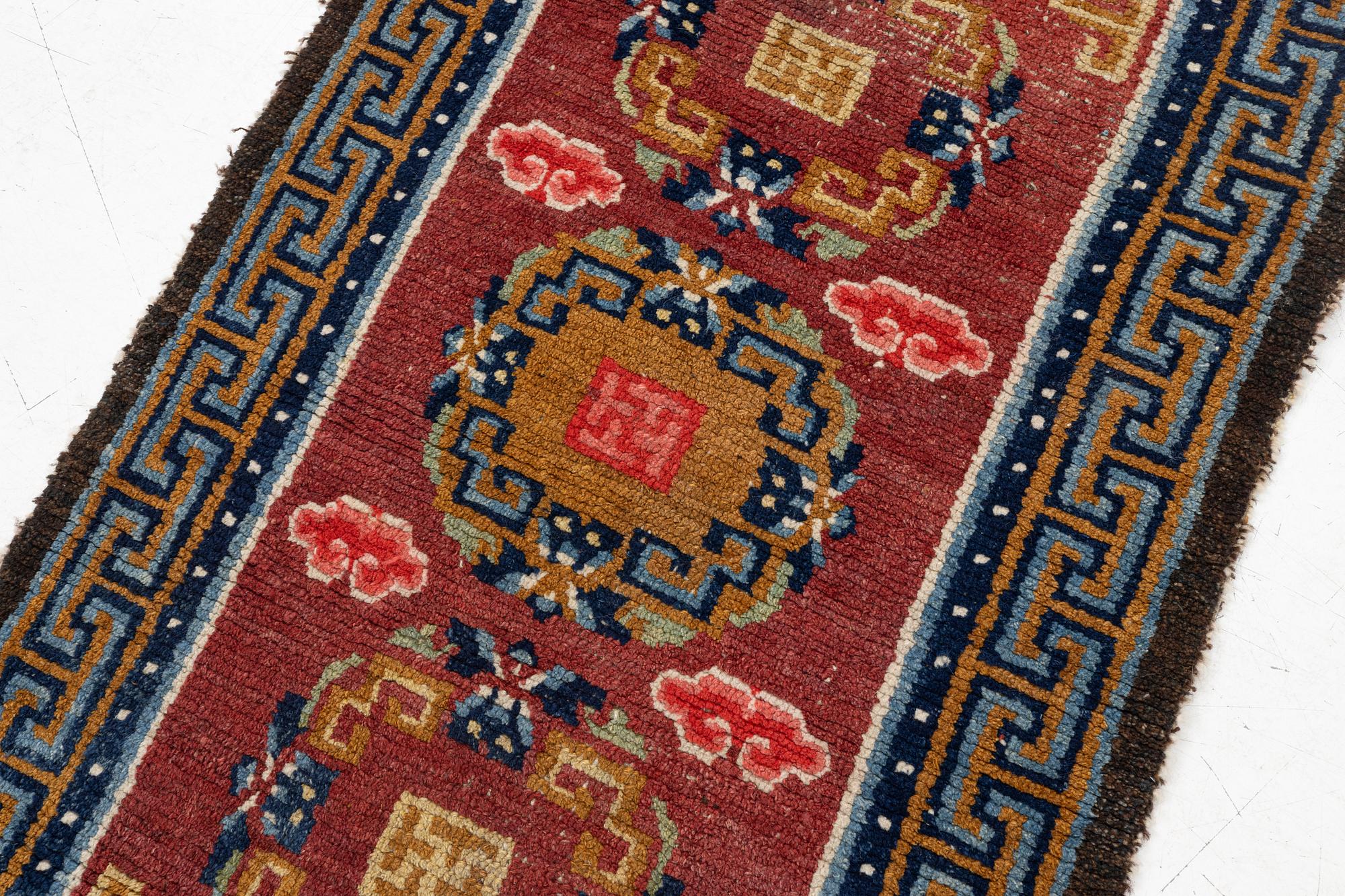 An antique Tibet 'Khaden' rug, c 135 x 70 cm.