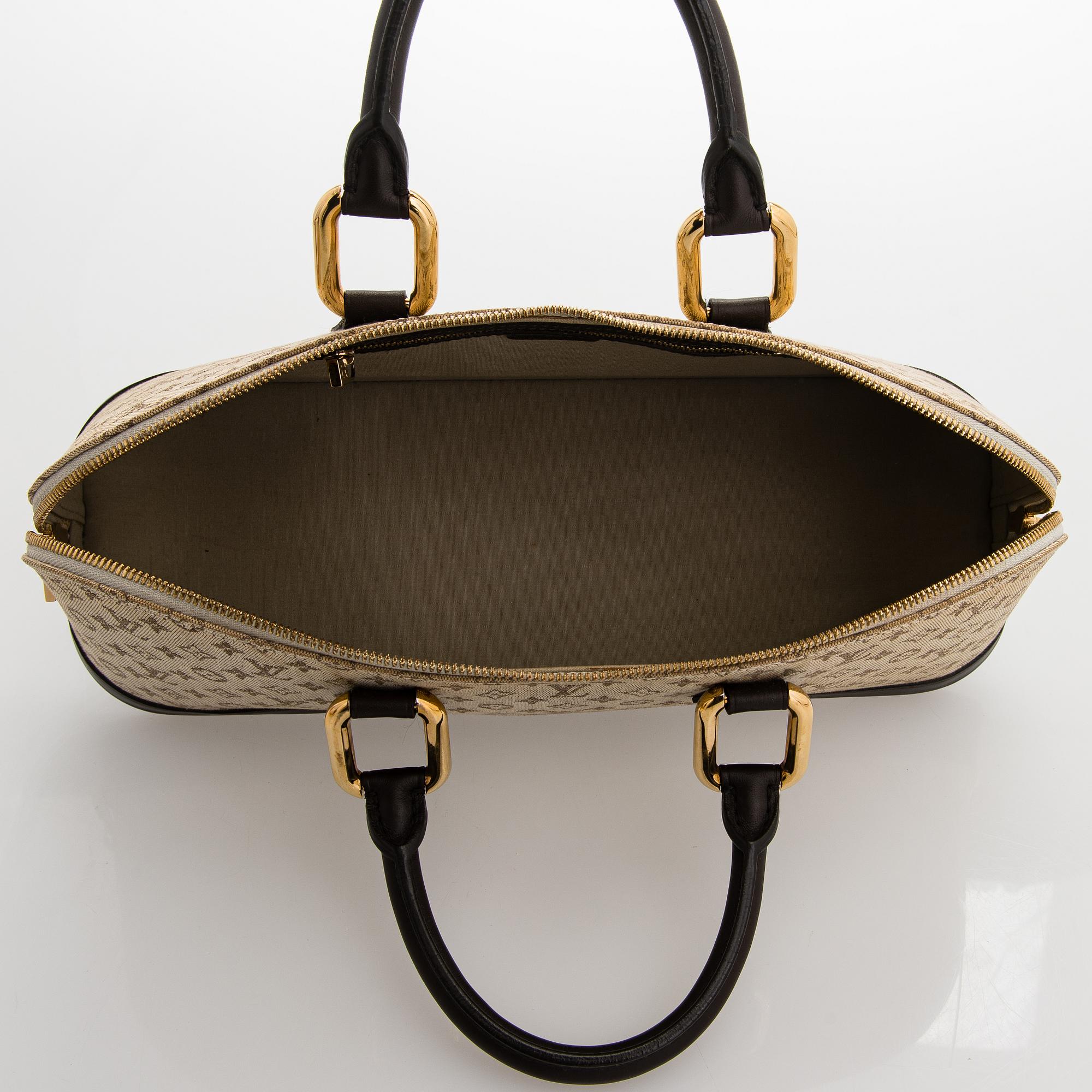 Louis Vuitton, a 'Monogram Mini Lin Alma Long Handbag'.
