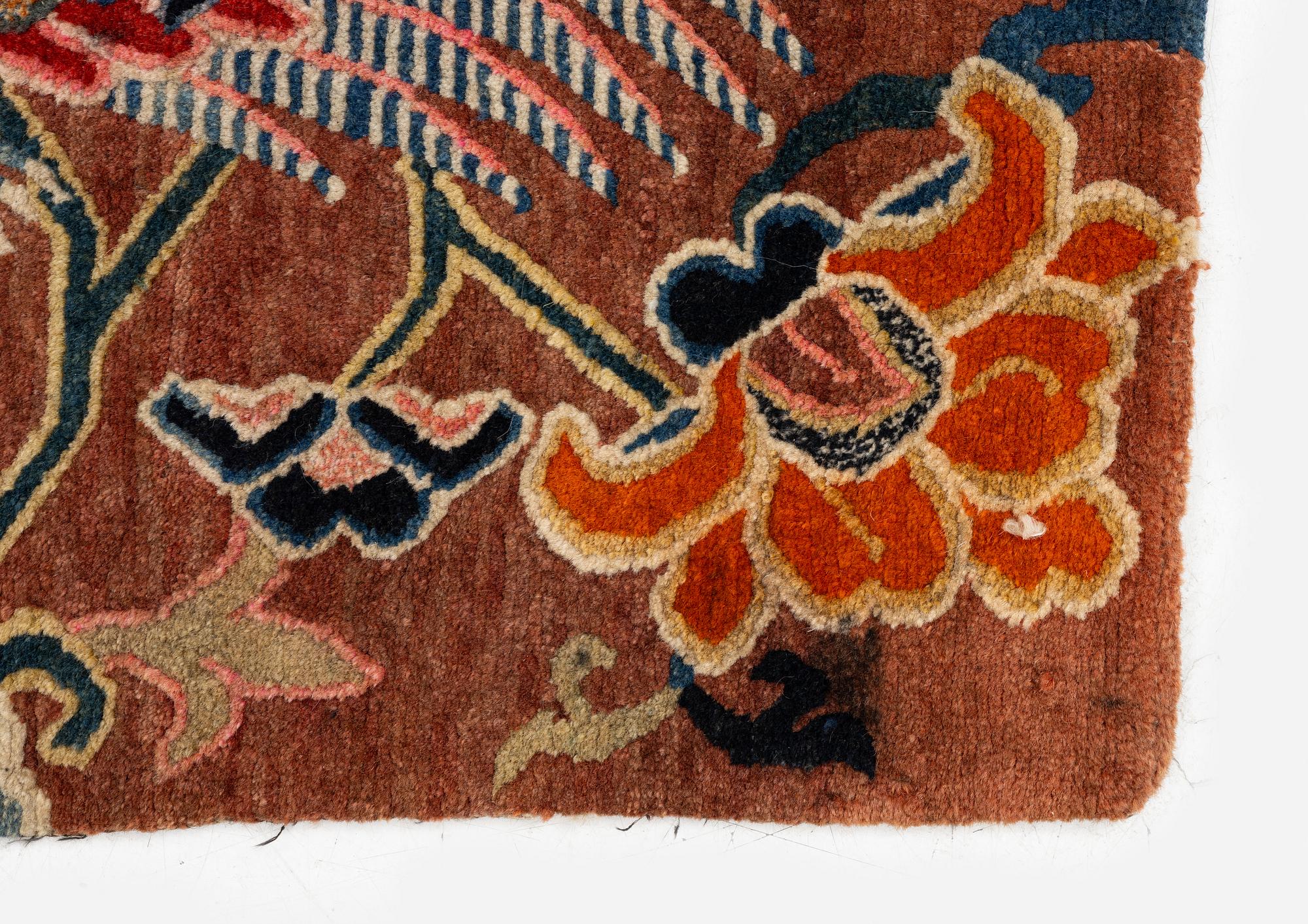 An antique 'Khagangma' rug, Tibet, around 1900. c. 74x63 cm.