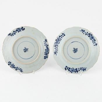 A set of four blue and white dinner plates, Qing dynasty, 18th Century.