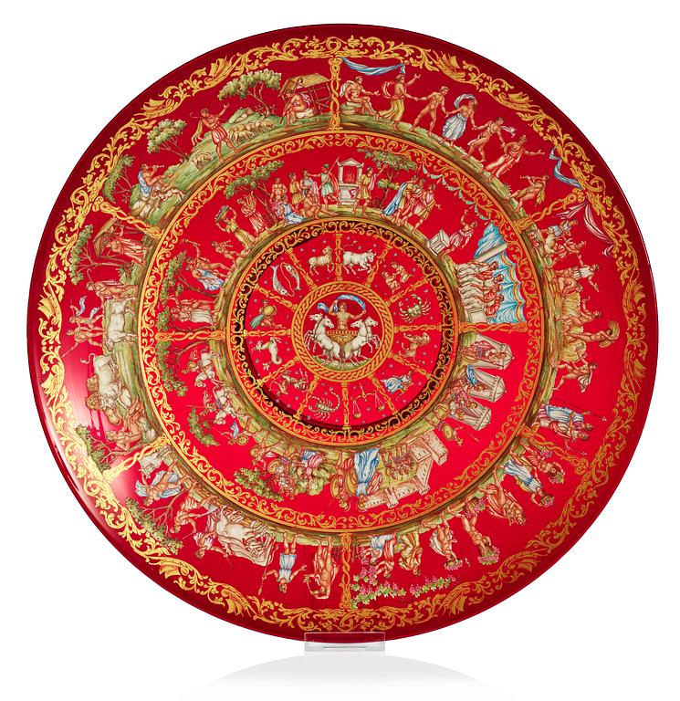 A large enamelled red glass charger, Italy/France, ca 1800.