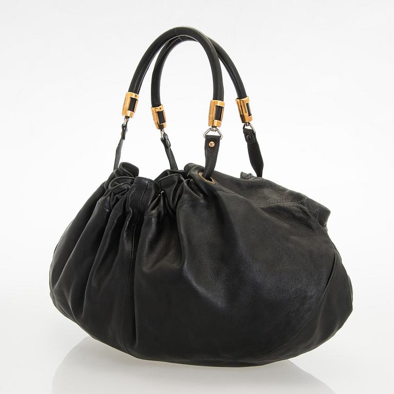 Emporio Armani, a leather bag.