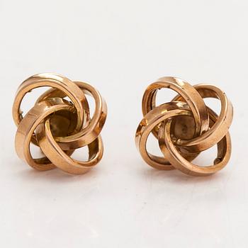 A pair of 14K gold earrings.