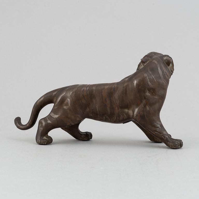A Japanese bronze okimono in the shape of a tiger, Meiji period (1868-1912), late 19th century. Signed 'Mitani'.
