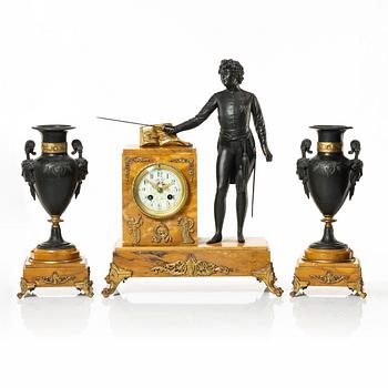An Empire style mantel clock and two urns, early 20th Century.
