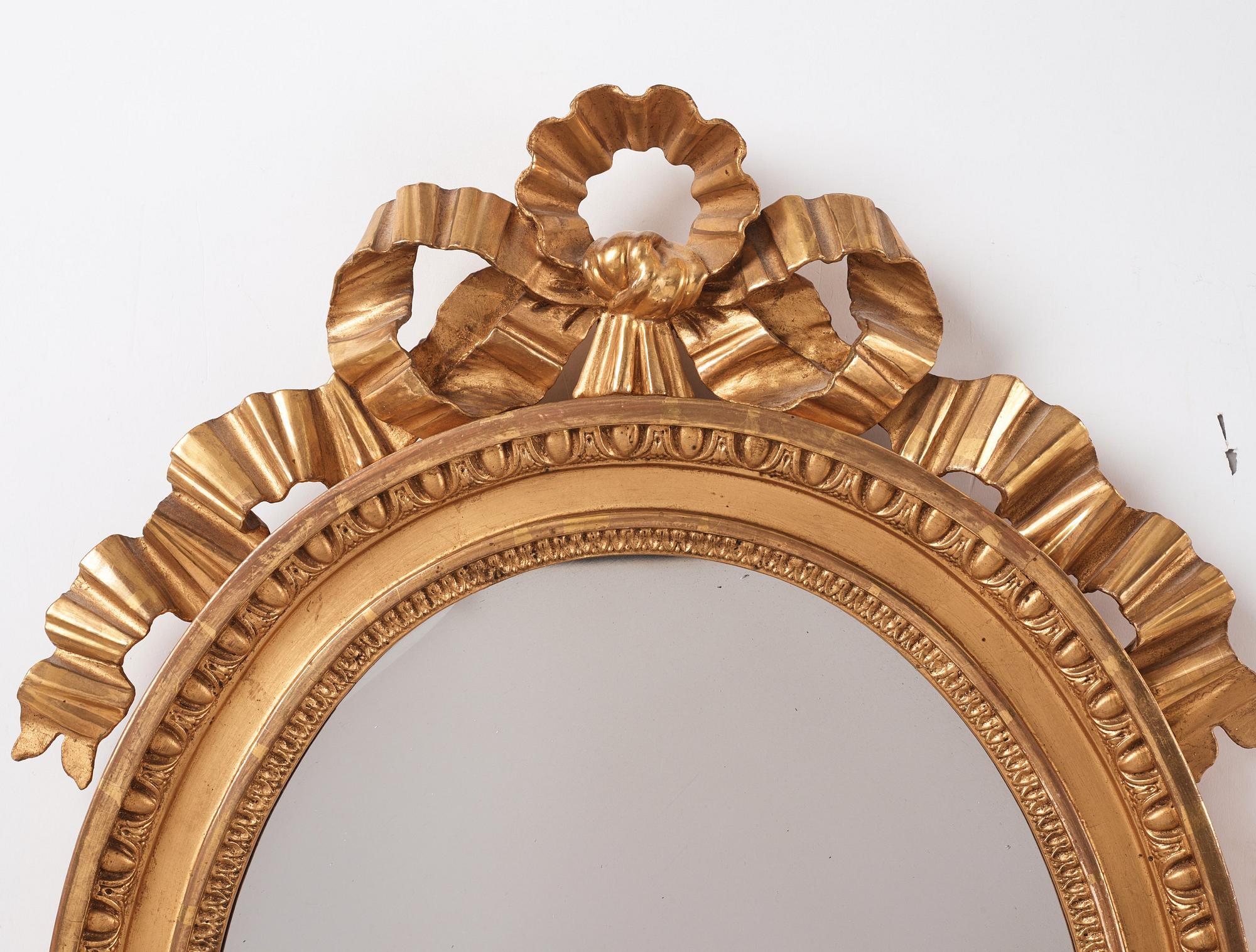A Gustavian two light girandole mirror. (later copy will follow the lot).