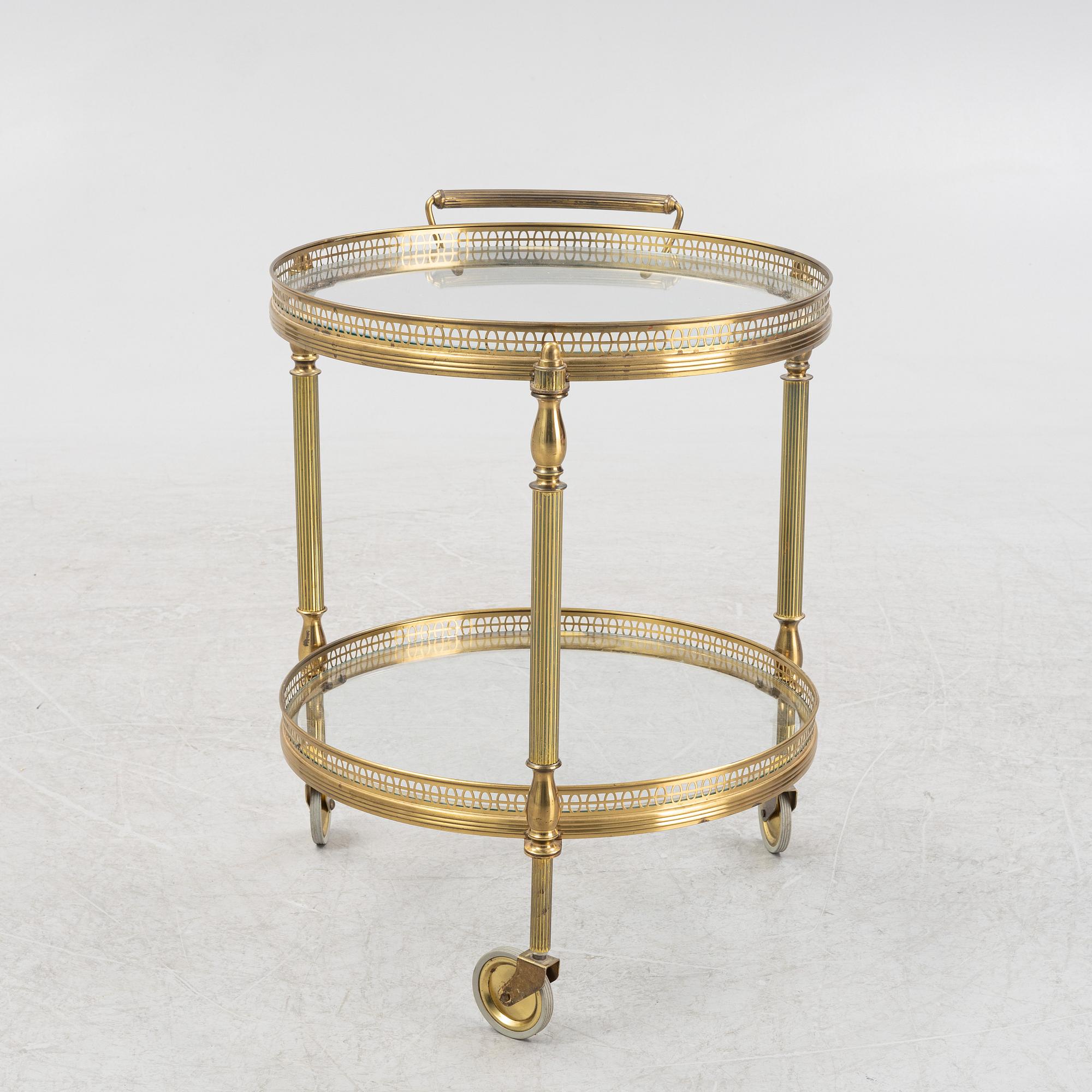 A glass and brass servin trolley, second part of the 20th Century.