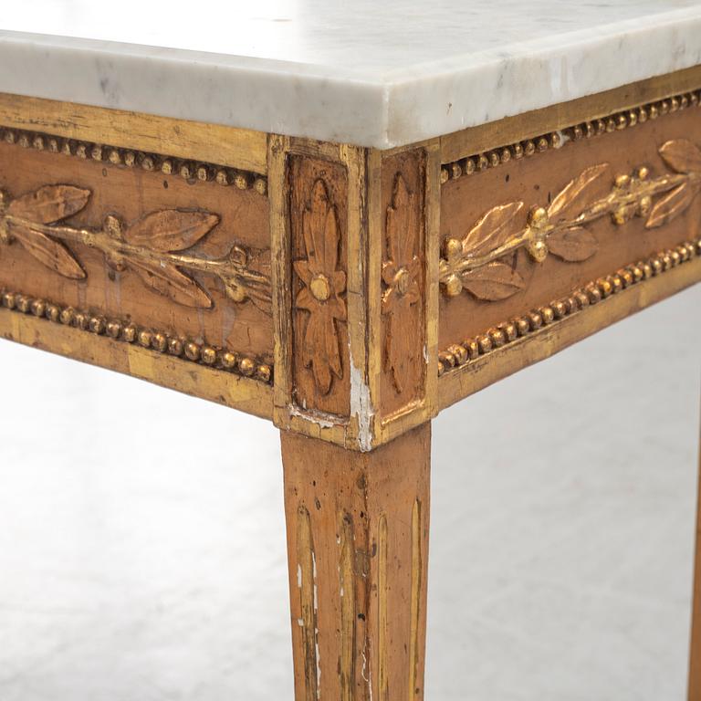 A Gustavian giltwood console table, around year 1800.