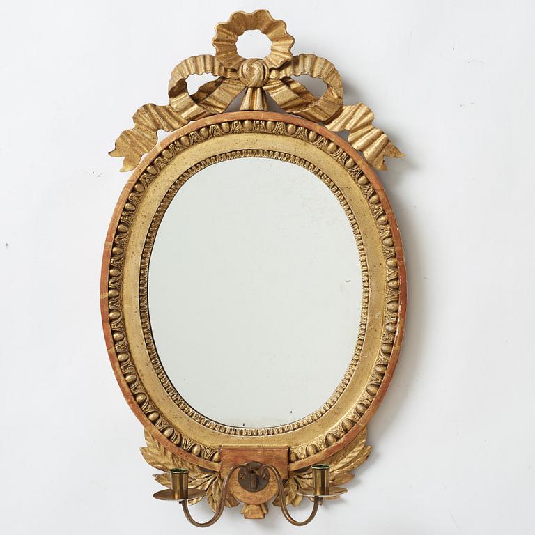 A late gustavian girandole mirror signed by Claes Eric Reding, Karlskrona, (master 1808-1815).