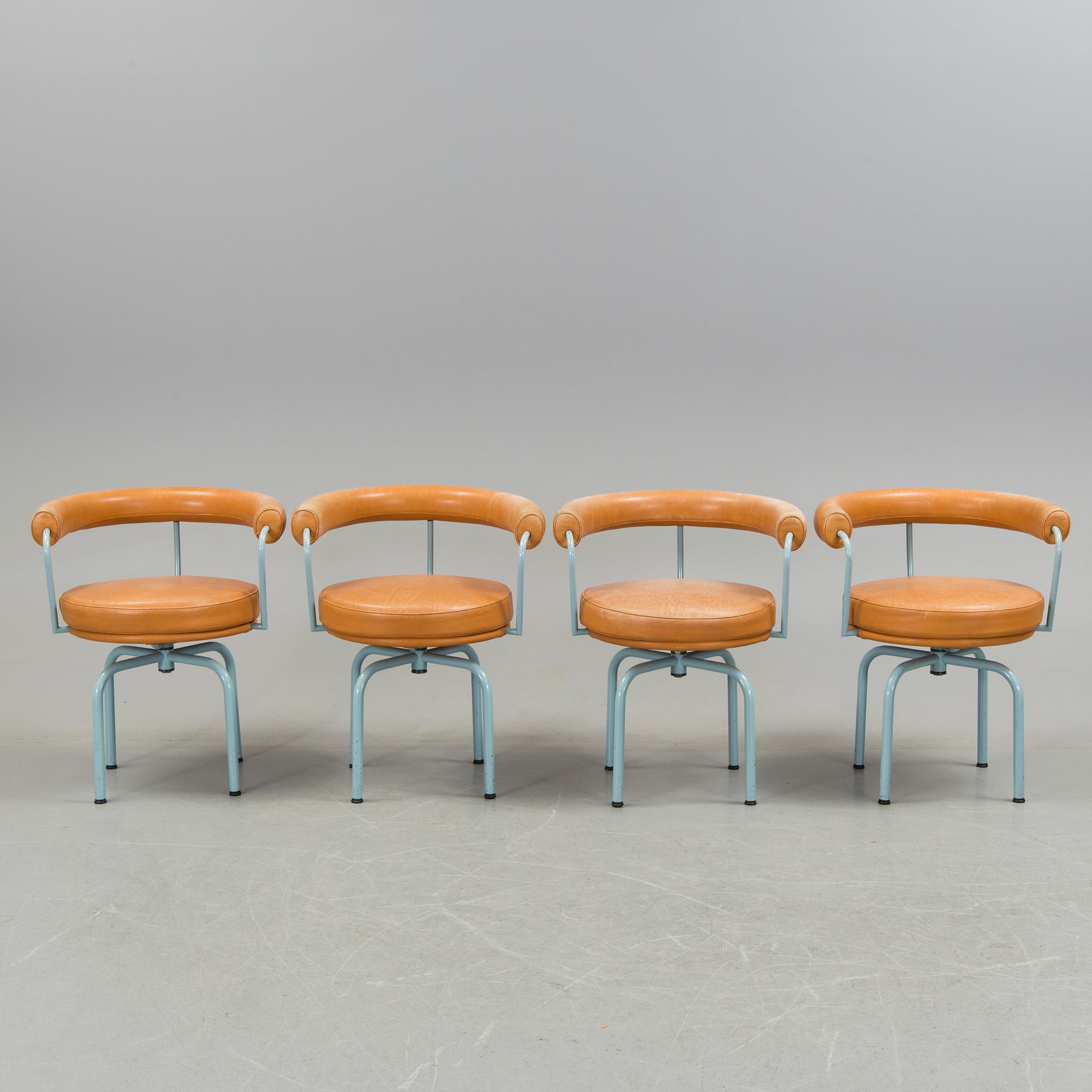 A set of four "LC7" chairs by Le Corbusier, Pierre Jeanneret and Charlotte Perriand for Cassina.
