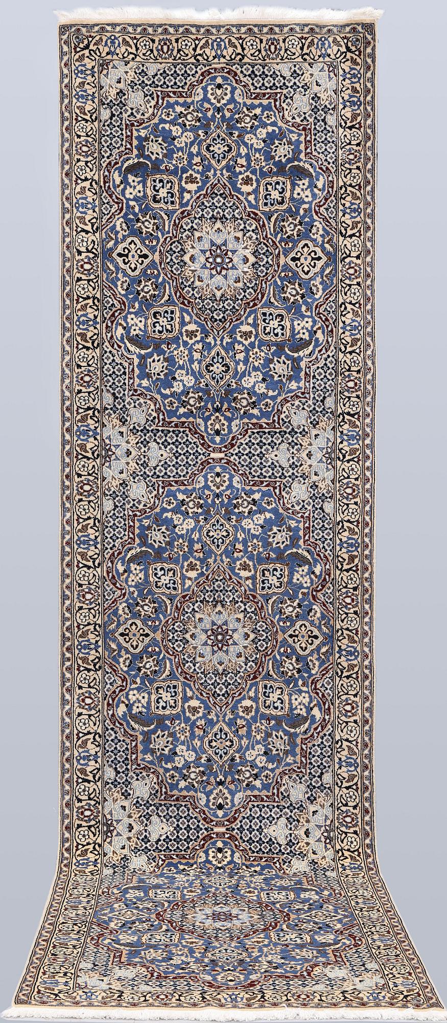 A carpet,  Nain, part silk, so-called 9 LAA, approx. 382 x 99 cm.