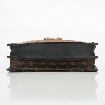 Louis Vuitton, a "Reverse Monogram Trunk Clutch" bag.
