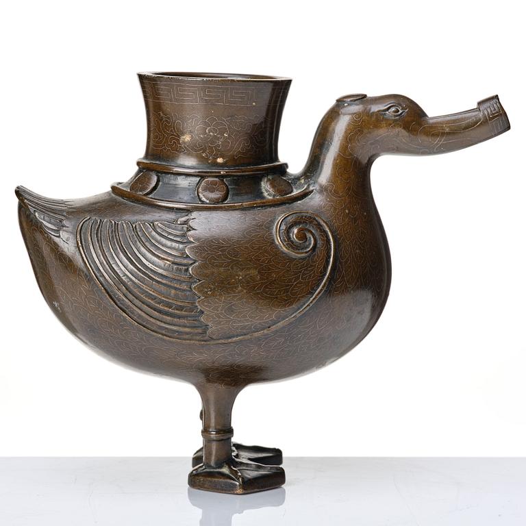 A bronze archaistic duck shaped vessel with silver inlay, Qing dynasty (1644-1912).