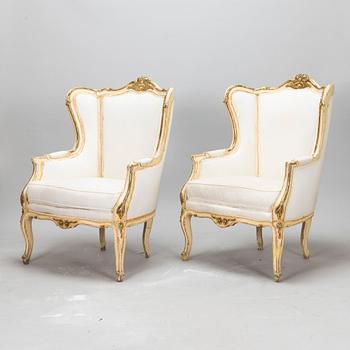 A pair of louis quinze style bergerer armchairs, first part of the 20th century.