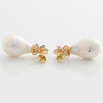 Earrings with cultured baroque freshwater pearls and pink sapphires.