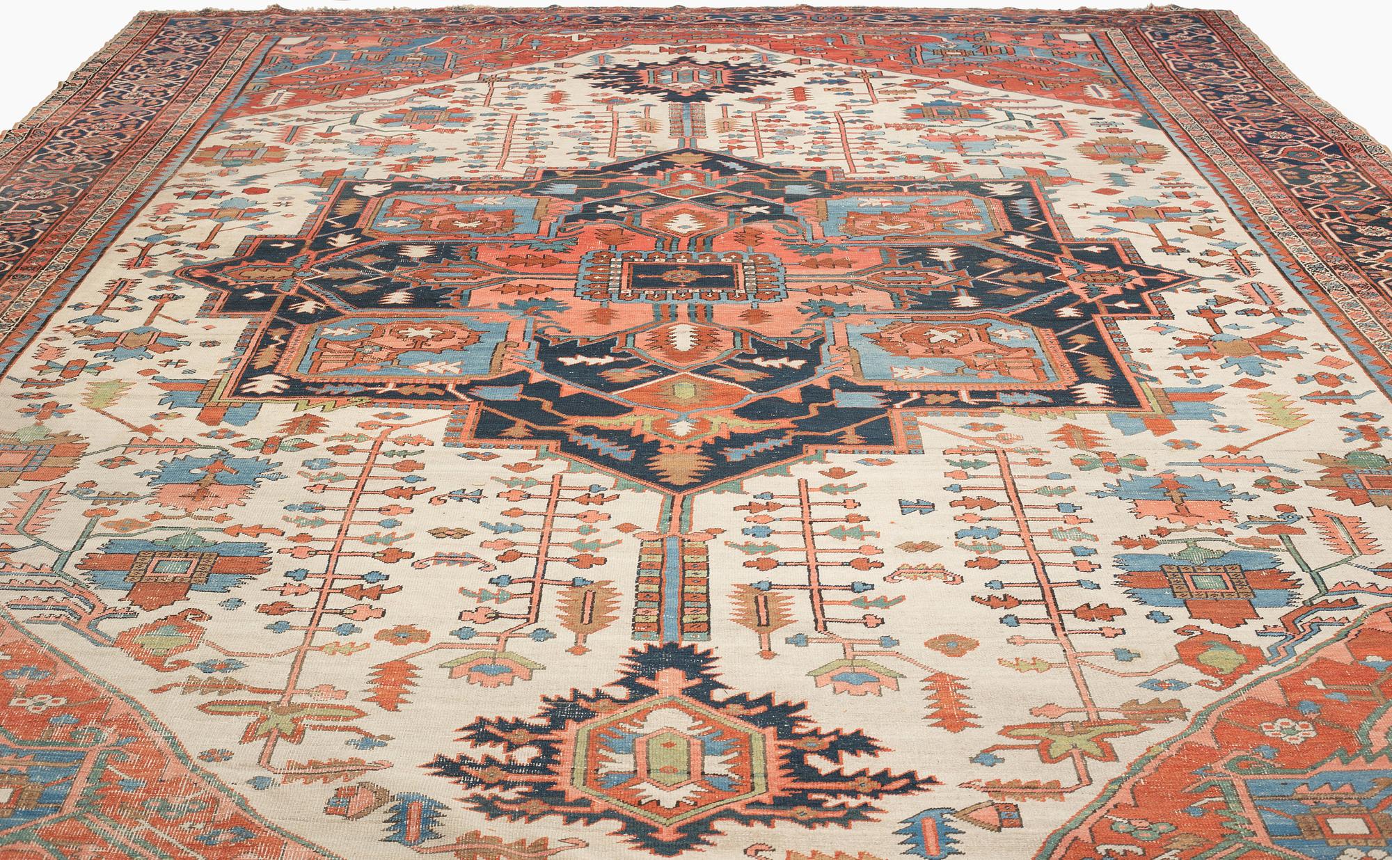 An antique Heriz Serapi carpet, West Persia, c. 616 x 407 cm.