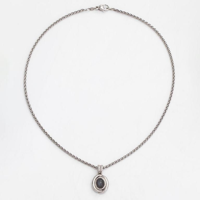 An 18K white gold necklace, with an oval cabochon-cut moonstone. Gallopin & Cie, Geneva.