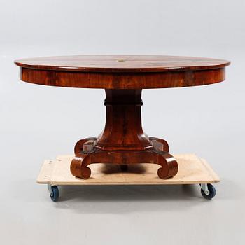 A late 19th century table with two extension leaves.