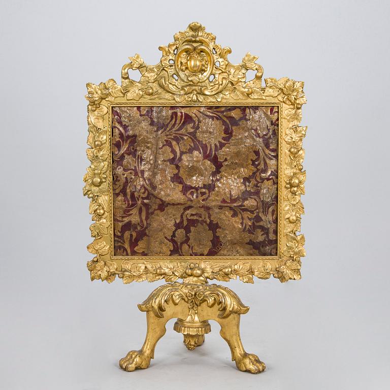 A Baroque style/Rococo revival brass protection, late 19th century.