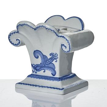 Wilhelm Kåge, eleven pieces of faience including jars, inkwells and a tulip vase, Gustavsberg, Sweden, 1919-1920.