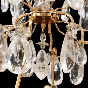 A late Baroque-style rock crystal twelve-light chandelier, circa 1900.