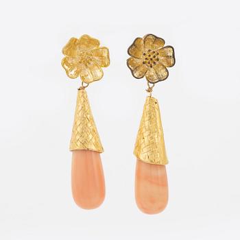 A pair of brass tone metal and stone earrings, Firma Svenskt Tenn.