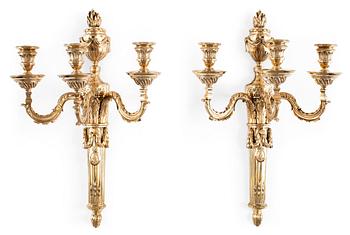 602. A pair of Louis XVI-style 19th Century three-light wall-lights.