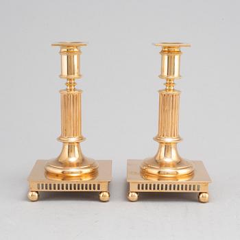 A pair of model 38 brass candlesticks from Gusums Bruk, first half of the 20th century.