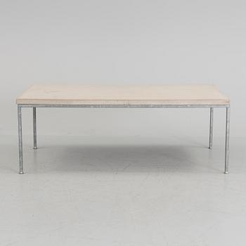 A modern sofa table with concrete top and steel legs.
