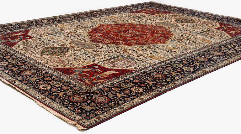 A semi-antique Benlian Tabriz carpet of 'Coronation' design, signed Jabarzade, c. 488 x 367 cm.