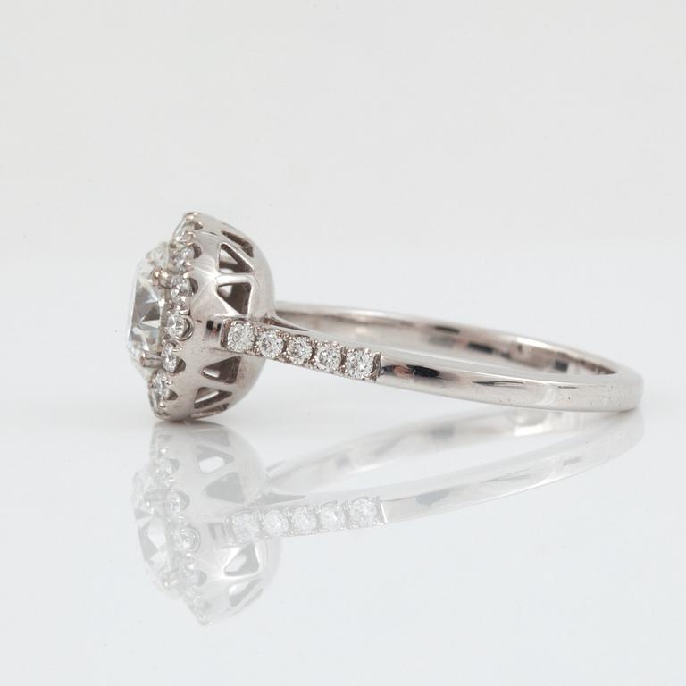 A brilliant-cut diamond ring. Center stone 1.50 cts F/IF according to IGI cert, surrounded by 0.36 ct pavé-set diamonds.