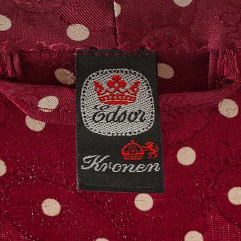 EDSOR KRONEN, a burgundy red and white polka dotted dressing gown.