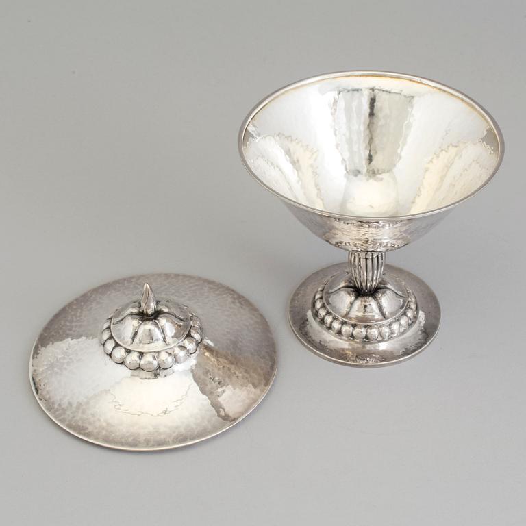 A Swedish Art Nouveau silver lidded bowl on stand, maker's mark CF Carlman, Stockholm, 1919.