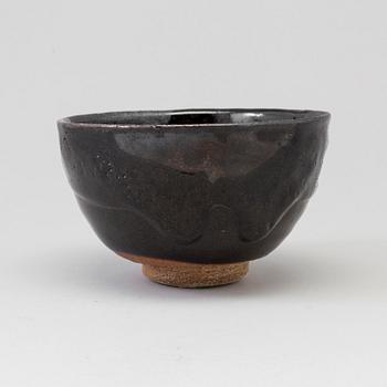 A Japanese Raku stoneware bowl, 20th century.